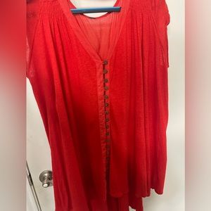 In good condition red free people blouse with buttons.
